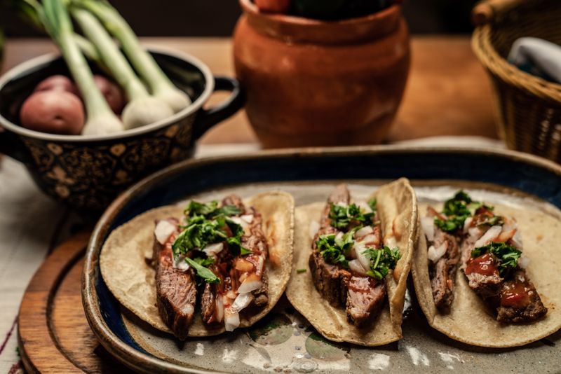 Cafe Rio birria beef tacos with consomme